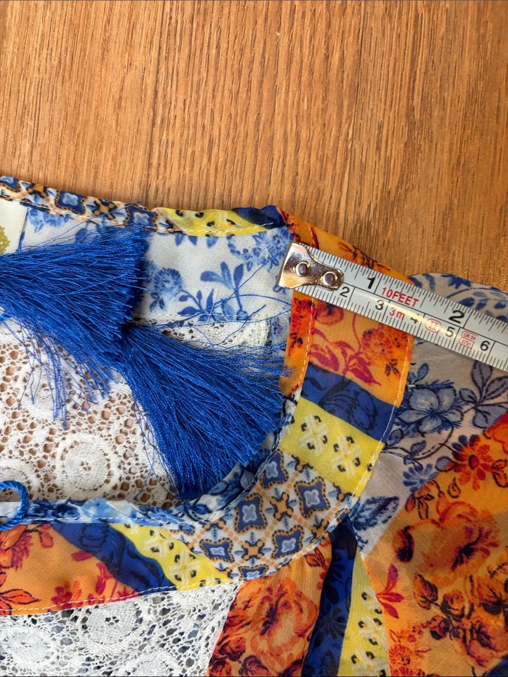 Fig & Flower blue, yellow & orange short sleeve semi-sheer top. Size M.